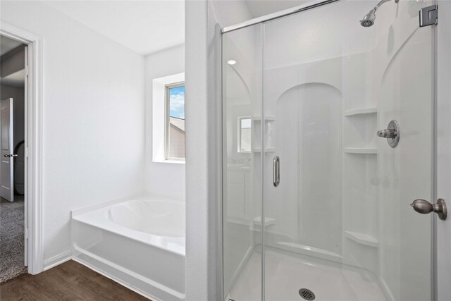212 Bryan Way, Angleton, TX 77515 - full bath with a stall shower, wood finished floors, and a garden tub