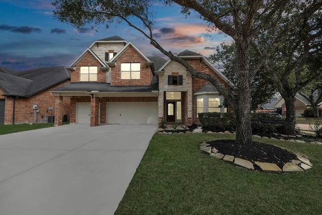 6423 Middlelake Ct, Katy, TX 77450 - view of front of house featuring driveway, a front yard, an attached garage, and brick siding