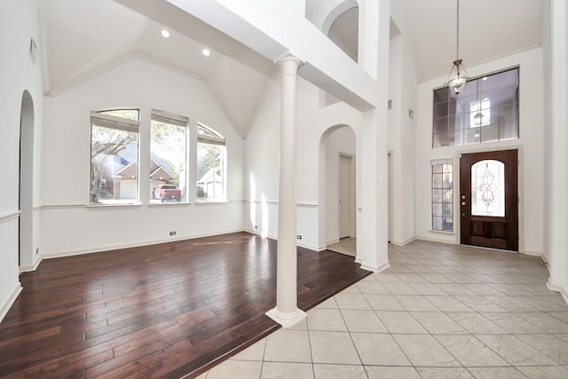 6423 Middlelake Ct, Katy, TX 77450 - foyer entrance featuring high vaulted ceiling, wood finished floors, recessed lighting, arched walkways, and baseboards