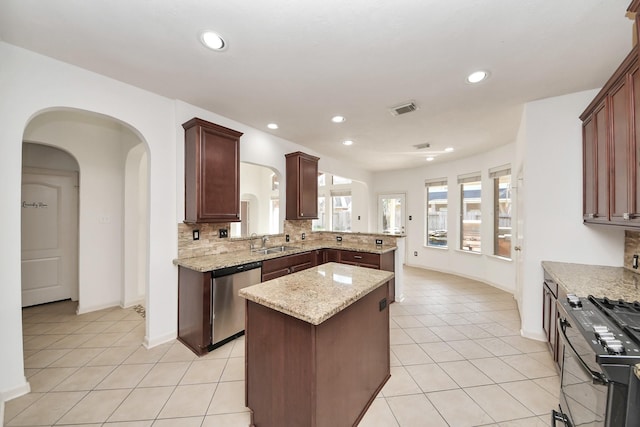 6423 Middlelake Ct, Katy, TX 77450 - kitchen featuring stainless steel dishwasher, a sink, light tile patterned floors, backsplash, and a kitchen island