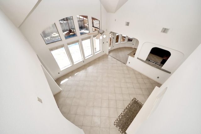 6423 Middlelake Ct, Katy, TX 77450 - unfurnished living room featuring a towering ceiling, tile patterned floors, and a ceiling fan