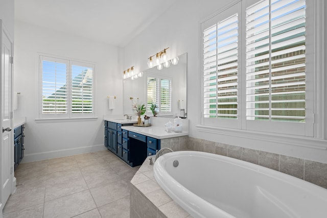 19843 Quarry Stone Ln, Richmond, TX 77407 - full bathroom featuring vanity, a bath, tile patterned flooring, and baseboards