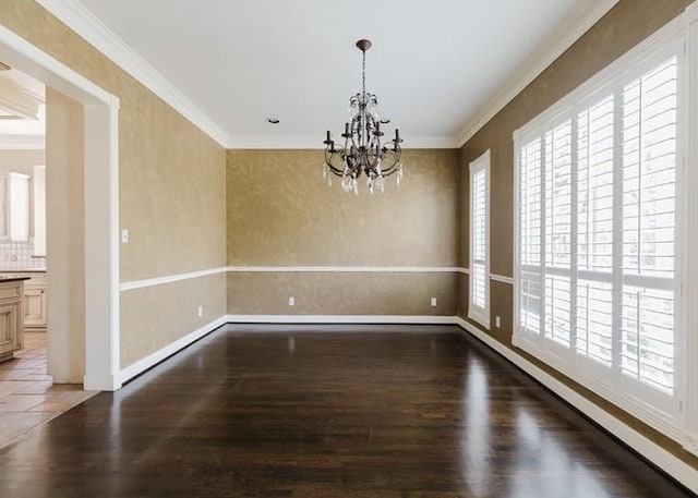 4135 Bellefontaine, Houston, TX 77025 - spare room with wood finished floors, a chandelier, crown molding, and baseboards