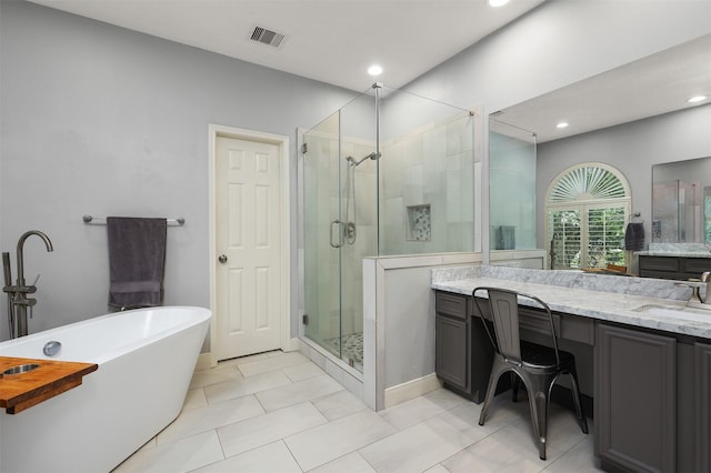 bathroom with visible vents, a shower stall, recessed lighting, vanity, and a freestanding bath