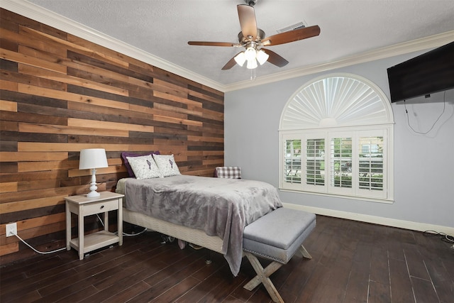 bedroom with dark wood-style flooring, visible vents, and crown molding