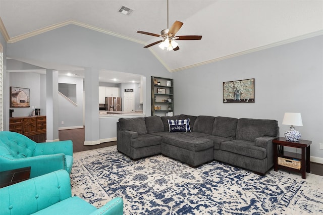 living area with visible vents, ceiling fan, ornamental molding, wood finished floors, and lofted ceiling