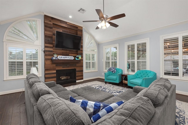 living room featuring visible vents, lofted ceiling, ornamental molding, and a ceiling fan