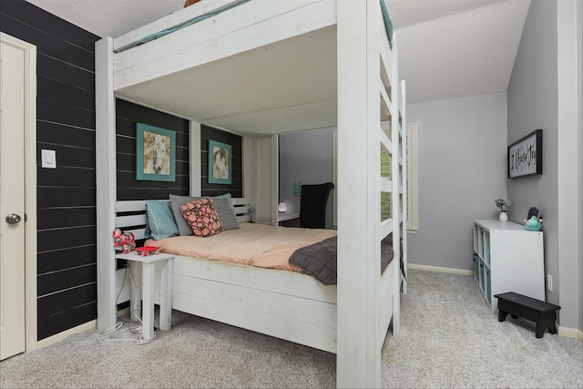 bedroom with carpet floors and baseboards