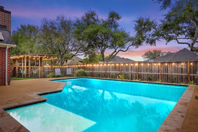 view of swimming pool with a fenced in pool, a fenced backyard, and a patio area