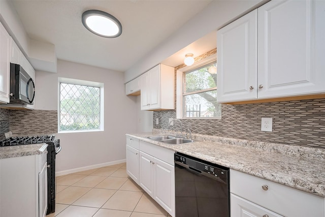 kitchen with white cabinets, a sink, range with gas cooktop, and black dishwasher