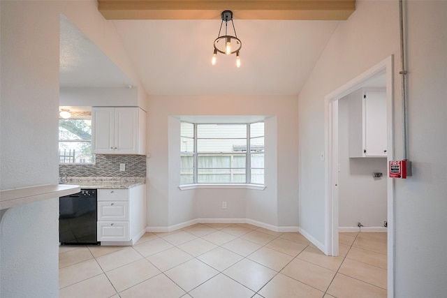 kitchen featuring white cabinetry, light tile patterned floors, baseboards, backsplash, and black dishwasher