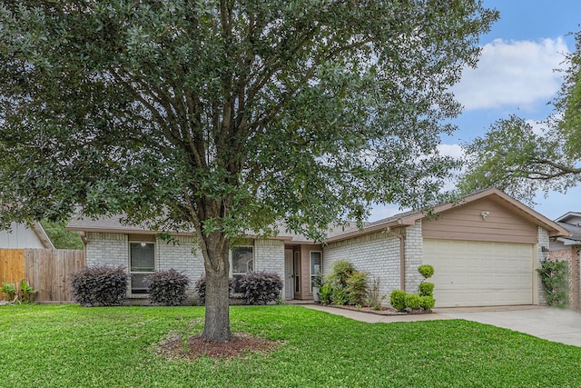 5427 Cairnleigh Dr, Houston, TX 77084 - view of front facade featuring an attached garage, concrete driveway, and brick siding