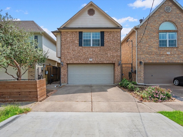 traditional-style house with brick siding, concrete driveway, a garage, and fence