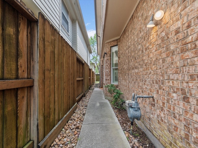 view of property exterior featuring brick siding