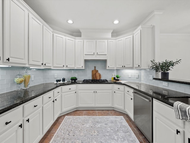 kitchen featuring dishwasher, white cabinetry, and decorative backsplash