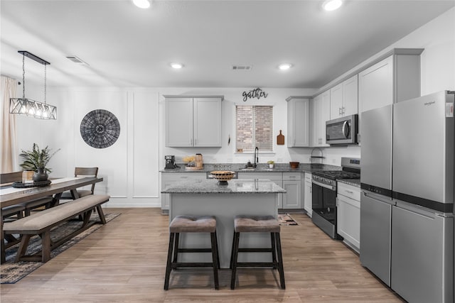 1100 Greenshank Dr, Katy, TX 77493 - kitchen with a sink, a center island, appliances with stainless steel finishes, and visible vents