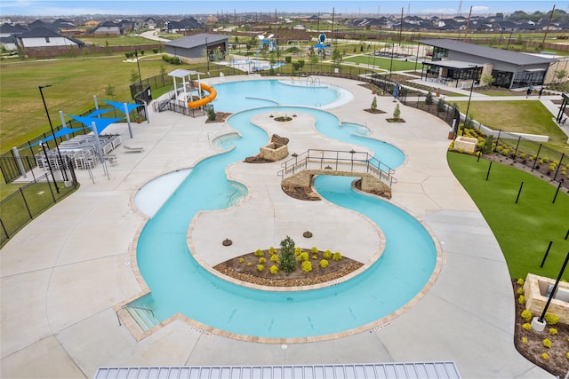 1100 Greenshank Dr, Katy, TX 77493 - pool with a patio area, a water play area, a water slide, and fence