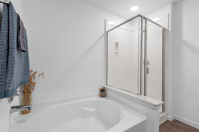 1100 Greenshank Dr, Katy, TX 77493 - full bathroom with a shower stall, baseboards, wood finished floors, and a bath