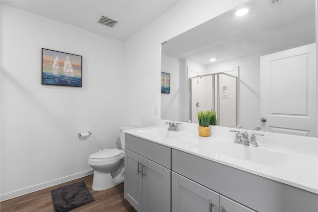 1100 Greenshank Dr, Katy, TX 77493 - bathroom featuring visible vents, a sink, a stall shower, and toilet