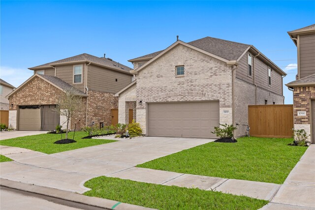 1100 Greenshank Dr, Katy, TX 77493 - view of front of property with brick siding, driveway, a garage, and a front lawn