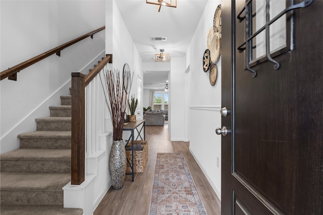 1100 Greenshank Dr, Katy, TX 77493 - entryway with wood finished floors, stairway, and visible vents