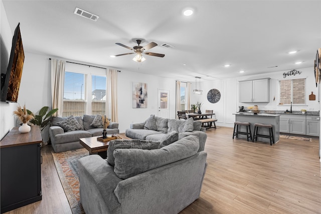 1100 Greenshank Dr, Katy, TX 77493 - living room featuring visible vents, light wood-style floors, ceiling fan, and recessed lighting