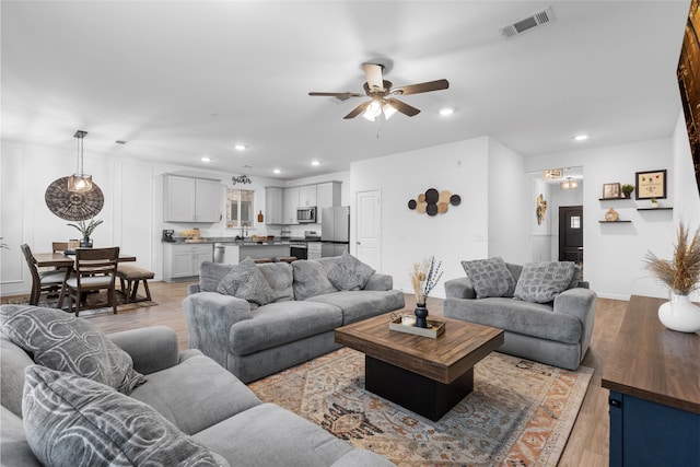 1100 Greenshank Dr, Katy, TX 77493 - living room featuring recessed lighting, ceiling fan, visible vents, and light wood-style floors