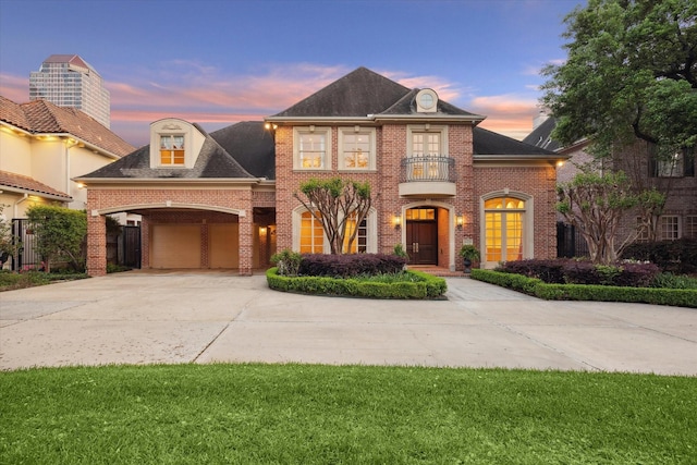 5079 Cedar Creek Dr, Houston, TX 77056 - colonial house featuring concrete driveway, a balcony, brick siding, an attached garage, and fence