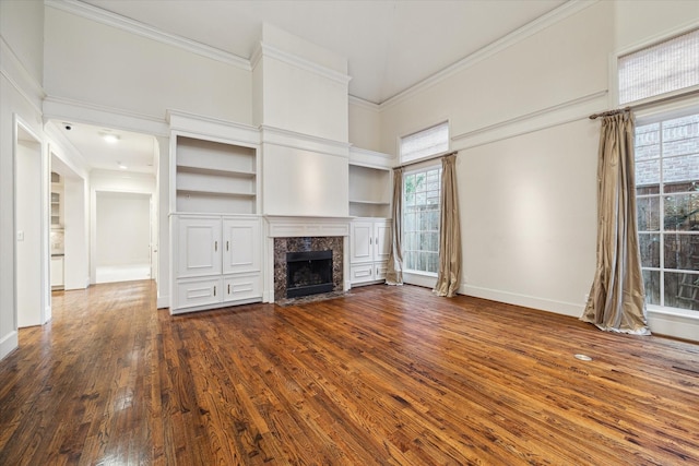 5079 Cedar Creek Dr, Houston, TX 77056 - unfurnished living room featuring dark wood-type flooring, crown molding, a premium fireplace, baseboards, and a high ceiling
