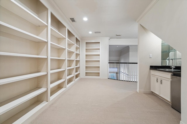 5079 Cedar Creek Dr, Houston, TX 77056 - bar area with light colored carpet, crown molding, baseboards, stainless steel dishwasher, and a sink