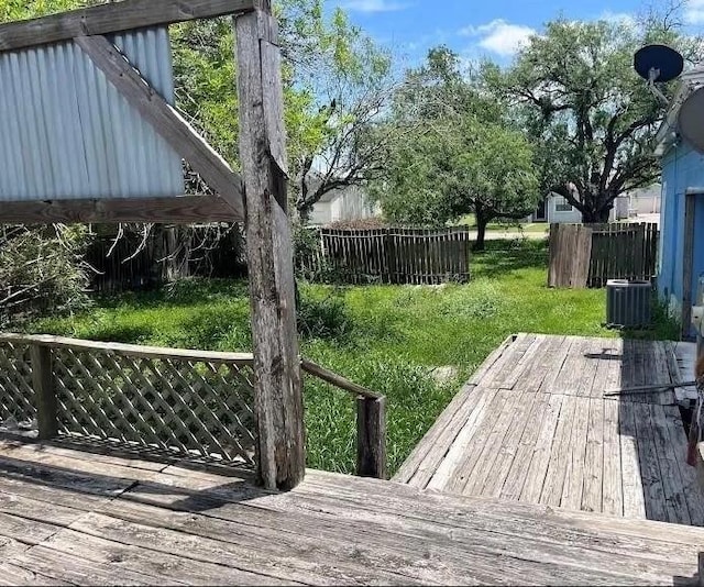 405 E Main St, Bishop, TX 78343 - deck featuring central AC unit and fence