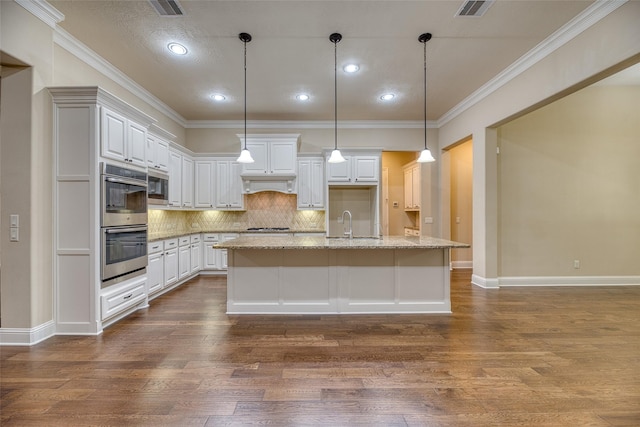 107 Lake View Loop, Fulshear, TX 77441 - kitchen with stainless steel appliances, dark wood-type flooring, decorative backsplash, white cabinets, and recessed lighting