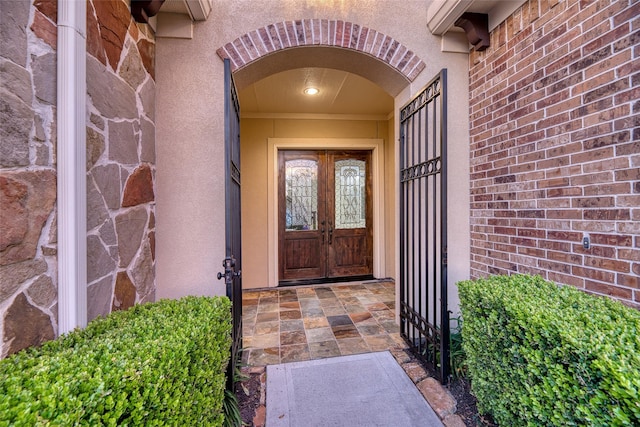 107 Lake View Loop, Fulshear, TX 77441 - entrance to property with stucco siding, french doors, and brick siding