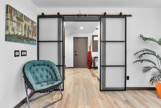 618 Lester St, Houston, TX 77007 - living area featuring a barn door, light wood-style floors, and recessed lighting