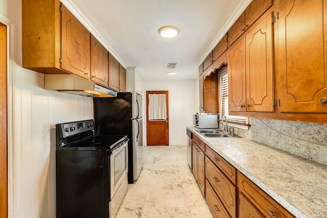 kitchen with light countertops, a sink, appliances with stainless steel finishes, brown cabinets, and under cabinet range hood