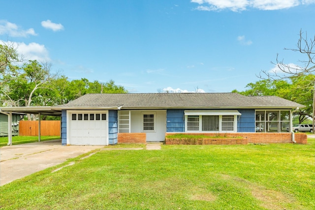 ranch-style home with concrete driveway, fence, roof with shingles, an attached garage, and a front yard