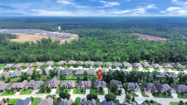 2019 Doolan Dr, Conroe, TX 77301 - drone / aerial view with a wooded view and a residential view
