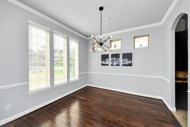 2019 Doolan Dr, Conroe, TX 77301 - unfurnished dining area featuring baseboards, an inviting chandelier, wood-type flooring, arched walkways, and ornamental molding