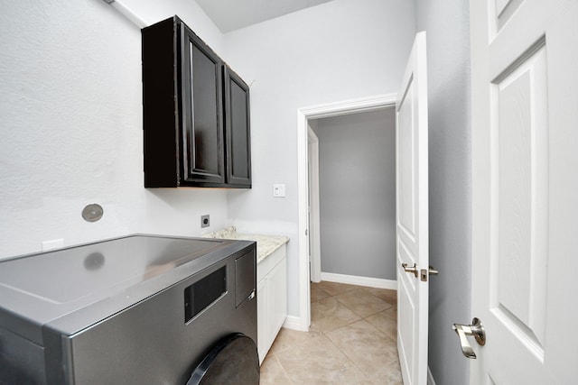 2019 Doolan Dr, Conroe, TX 77301 - laundry room featuring light tile patterned floors, washer / clothes dryer, and cabinet space