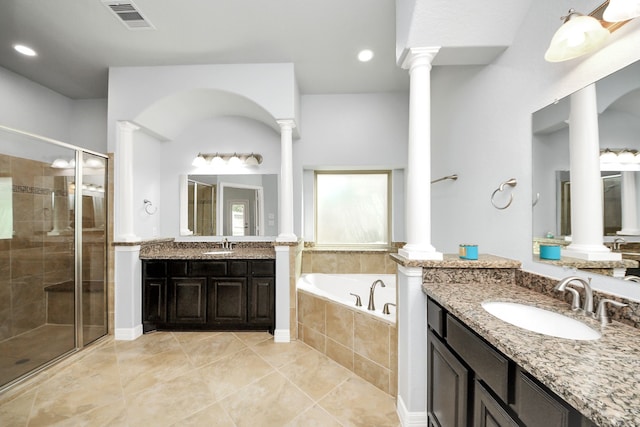 2019 Doolan Dr, Conroe, TX 77301 - full bathroom with a garden tub, a sink, decorative columns, and visible vents