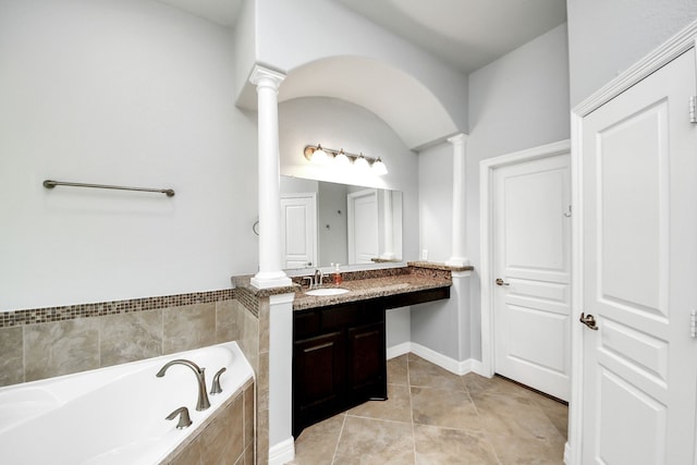 2019 Doolan Dr, Conroe, TX 77301 - full bathroom with a garden tub, tile patterned flooring, decorative columns, and vanity