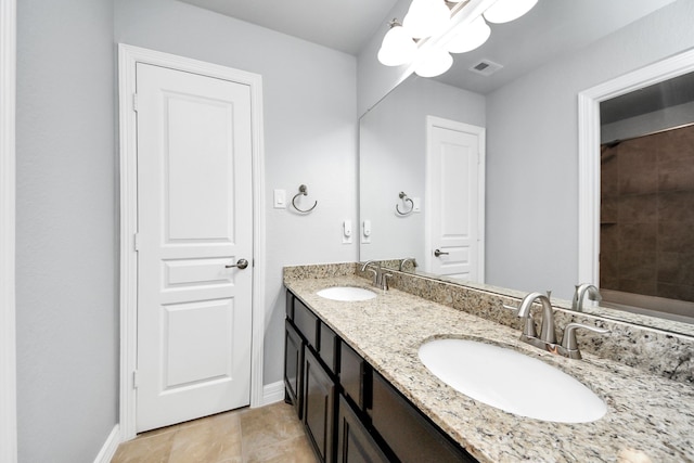 2019 Doolan Dr, Conroe, TX 77301 - bathroom featuring baseboards, visible vents, and a sink