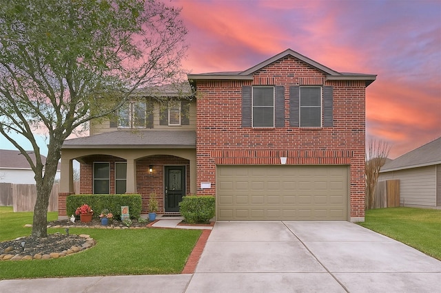 traditional-style home featuring brick siding, fence, driveway, and a yard