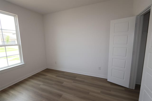 8526 Pier Cove Dr, Cypress, TX 77433 - unfurnished room featuring dark wood-style flooring and baseboards