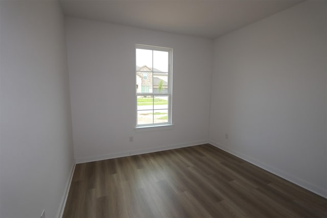 8526 Pier Cove Dr, Cypress, TX 77433 - unfurnished room with dark wood-style flooring and baseboards