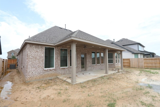 8526 Pier Cove Dr, Cypress, TX 77433 - rear view of property featuring brick siding, a patio, and a fenced backyard
