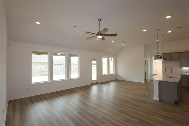 8526 Pier Cove Dr, Cypress, TX 77433 - unfurnished living room featuring a ceiling fan, vaulted ceiling, recessed lighting, and dark wood finished floors