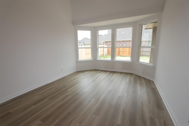 8526 Pier Cove Dr, Cypress, TX 77433 - empty room featuring dark wood-style flooring and baseboards
