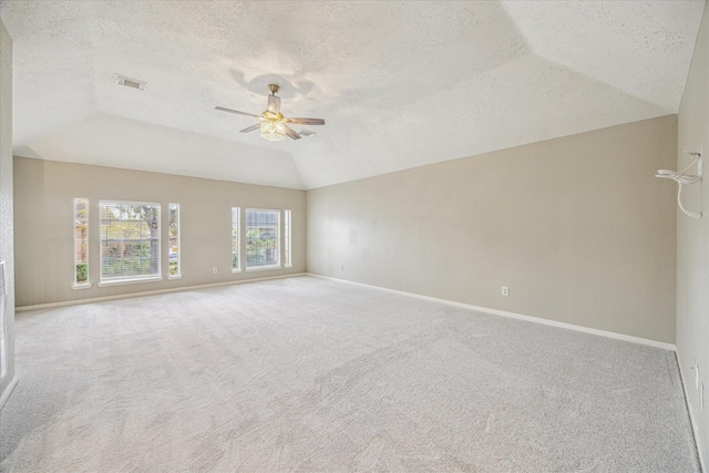12714 Orchard Hollow Way, Houston, TX 77065 - carpeted empty room featuring lofted ceiling, a ceiling fan, a textured ceiling, and baseboards