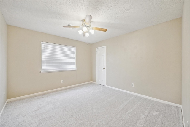 12714 Orchard Hollow Way, Houston, TX 77065 - carpeted spare room featuring a ceiling fan, a textured ceiling, and baseboards